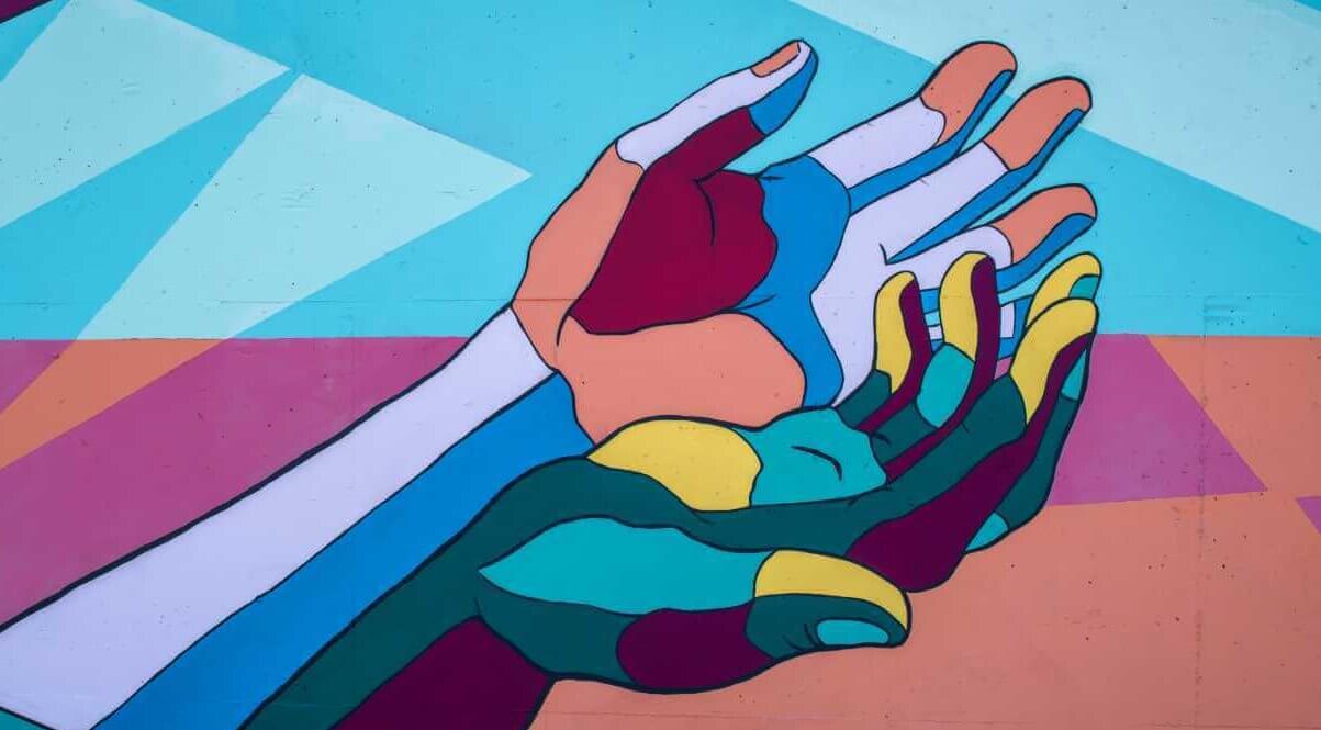 A colorful drawing of two wrists and hands.