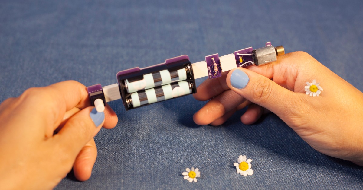 A closeup of the internal view of a vibrator, held by white hands.