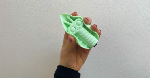 Cute Little Fuckers Zeep sex toy held up with silicone sides curving inward.