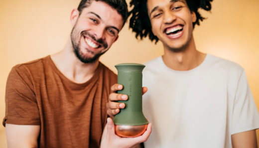 Two male models hold the MYHIXEL male masturbator for premature ejaculation treatment.